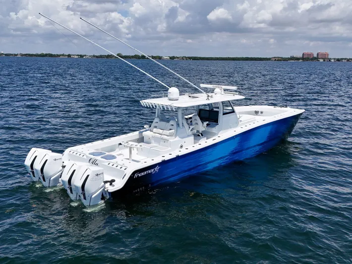  Yacht Photos Pics 2023 Freeman 47 boat on open water with dual outboard motors.