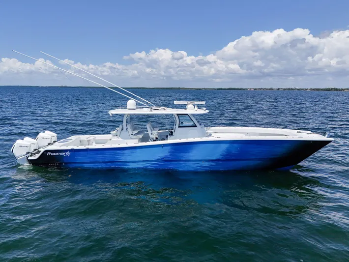  Yacht Photos Pics 2023 Freeman 47 boat on open water under a clear blue sky.