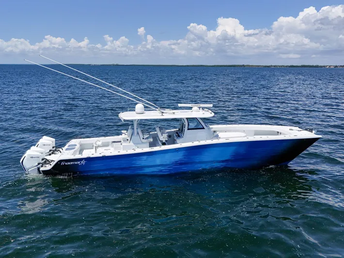  Yacht Photos Pics 2023 Freeman 47 boat on open water under a clear blue sky.