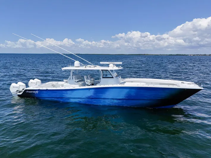  Yacht Photos Pics 2023 Freeman 47 boat on open water under clear blue sky.