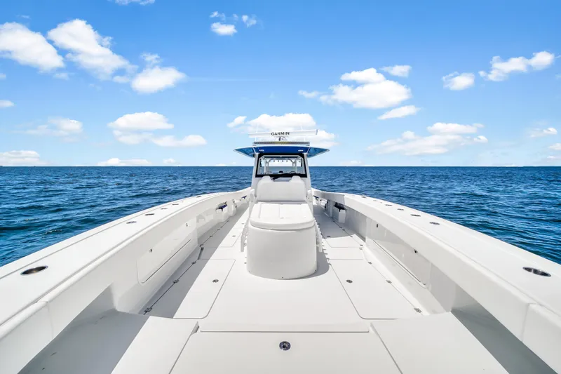  Yacht Photos Pics Freeman 47 boat on open sea under blue sky, 2023 model.