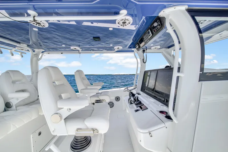  Yacht Photos Pics 2023 Freeman 47 boat interior with white seating and advanced navigation systems.