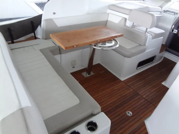 Lake Time, Austin, Tx Yacht Photos Pics Interior of 2017 Jeanneau LEADER 36 yacht with wooden flooring and seating area.