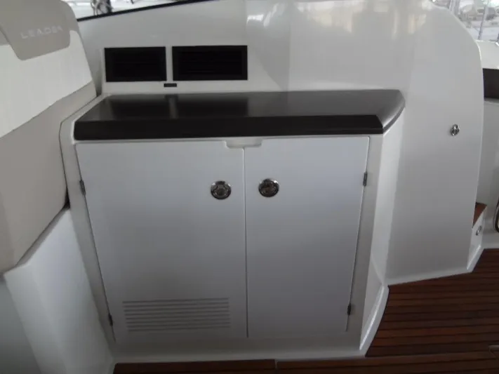 Lake Time, Austin, Tx Yacht Photos Pics 2017 Jeanneau LEADER 36 yacht interior with sleek cabinetry and wood flooring.