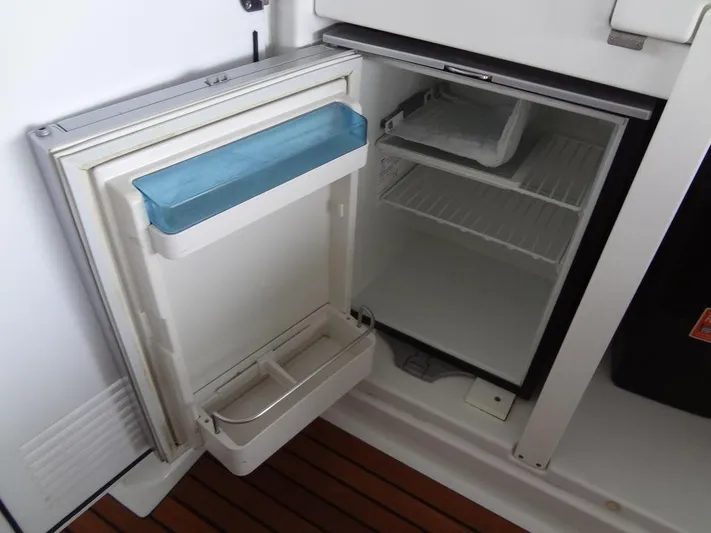 Lake Time, Austin, Tx Yacht Photos Pics Open refrigerator on Jeanneau LEADER 36 yacht, 2017 model, with wooden flooring.