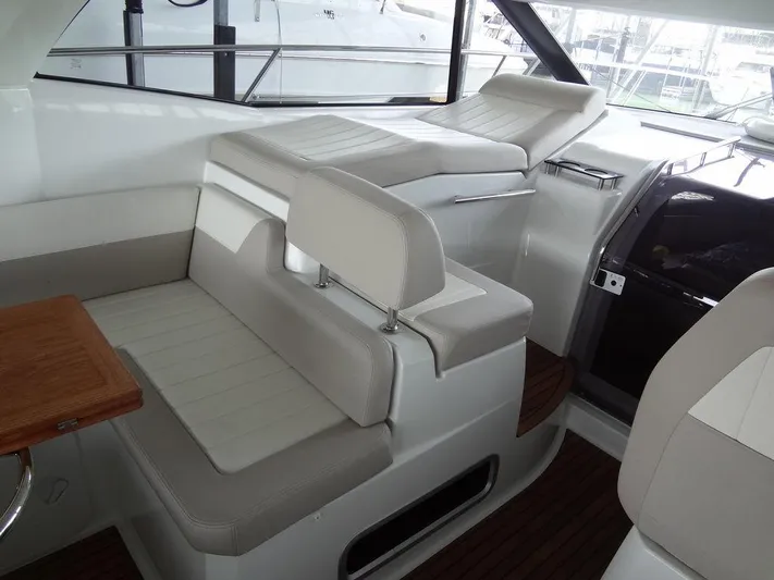 Lake Time, Austin, Tx Yacht Photos Pics Interior of 2017 Jeanneau LEADER 36 yacht with white seating and wooden accents.