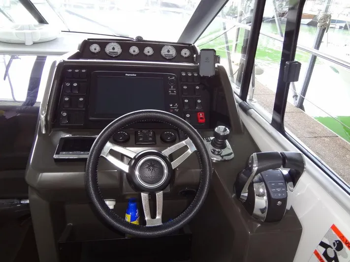 Lake Time, Austin, Tx Yacht Photos Pics 2017 Jeanneau LEADER 36 helm with steering wheel and control panel.