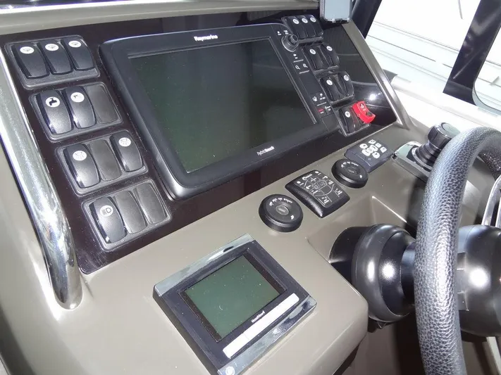 Lake Time, Austin, Tx Yacht Photos Pics 2017 Jeanneau LEADER 36 dashboard with navigation controls and steering wheel.