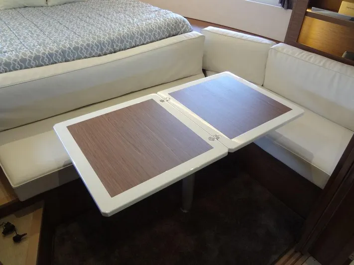 Lake Time, Austin, Tx Yacht Photos Pics Interior of 2017 Jeanneau LEADER 36 with foldable table and cushioned seating.