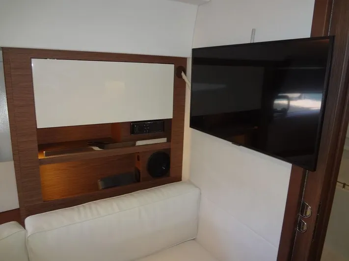 Lake Time, Austin, Tx Yacht Photos Pics Interior of 2017 Jeanneau LEADER 36 yacht with TV and white seating.