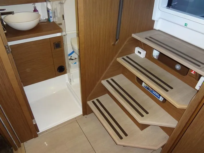 Lake Time, Austin, Tx Yacht Photos Pics 2017 Jeanneau Leader 36 interior with wooden stairs and compact bathroom.