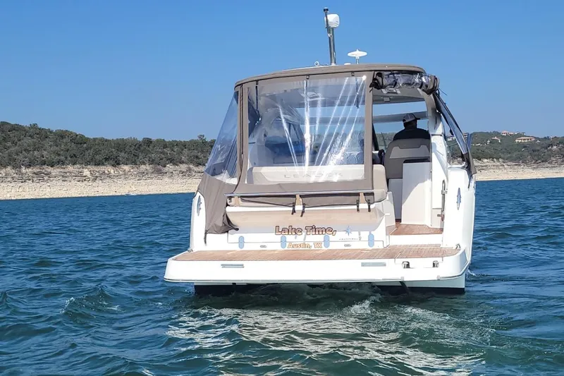 Lake Time, Austin, Tx Yacht Photos Pics 2017 Jeanneau LEADER 36 boat on a lake, rear view with clear skies.