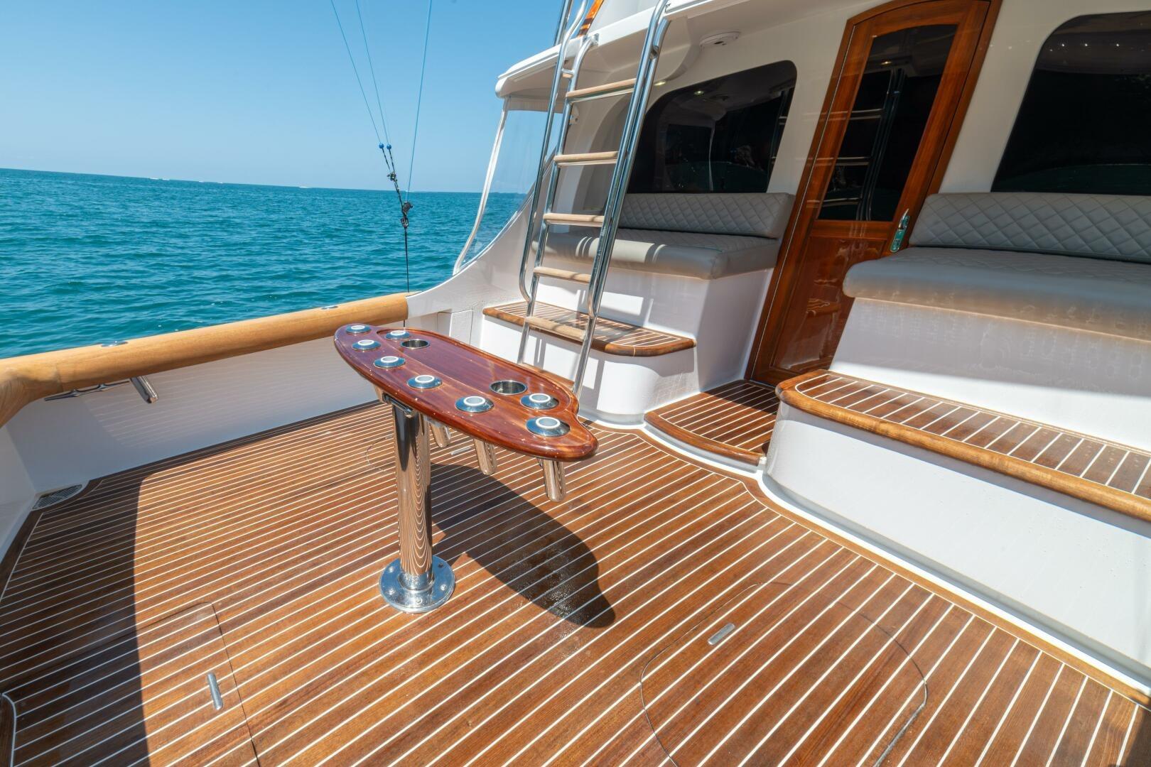 Luxurious 1991 Gamefisherman 40 yacht deck with wooden flooring and ocean view.