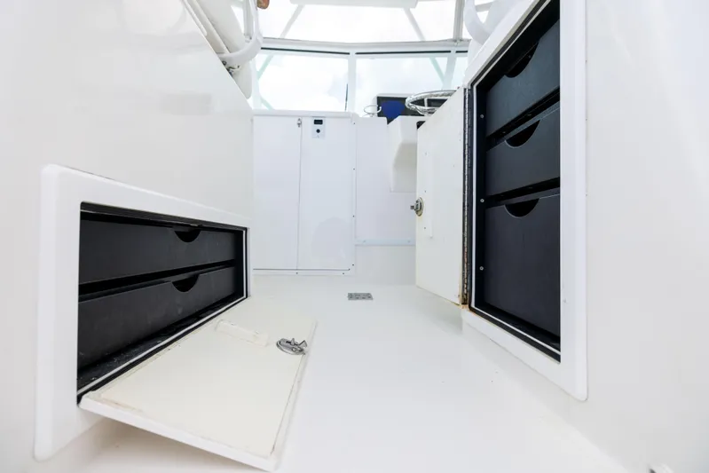  Yacht Photos Pics 2018 Albemarle 27 Express interior with storage compartments and sleek design.