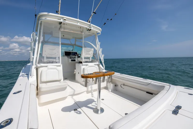  Yacht Photos Pics 2018 Albemarle 27 Express boat on open sea, featuring spacious deck and helm.