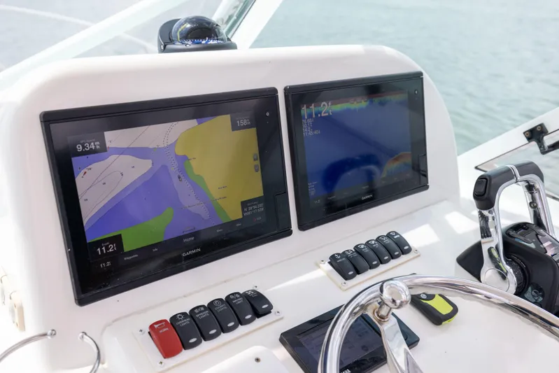  Yacht Photos Pics 2018 Albemarle 27 Express dashboard with dual navigation screens and control panel.