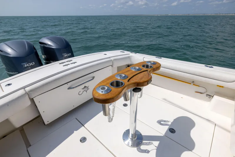  Yacht Photos Pics 2018 Albemarle 27 Express boat deck with dual engines and rod holders on open sea.