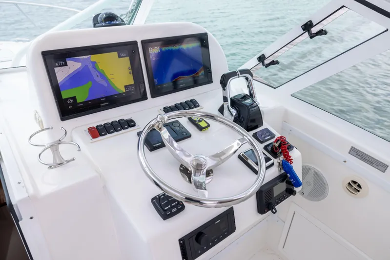  Yacht Photos Pics Helm of 2018 Albemarle 27 Express with navigation screens and steering wheel.