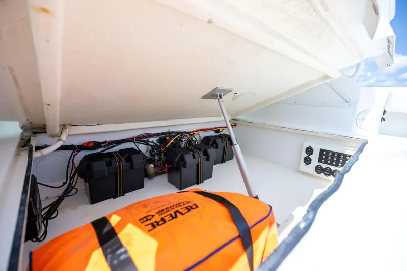  Yacht Photos Pics 2018 Albemarle 27 Express boat storage compartment with batteries and safety equipment.