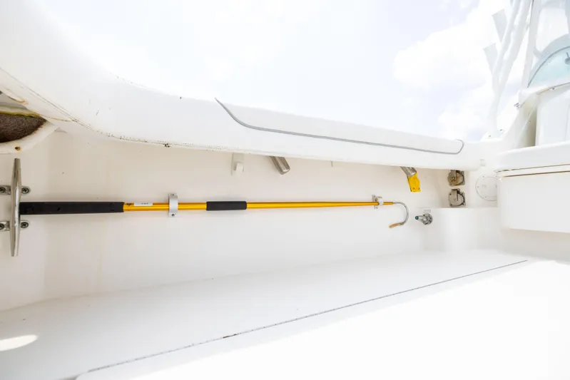  Yacht Photos Pics 2018 Albemarle 27 Express boat interior with mounted yellow boat hook.
