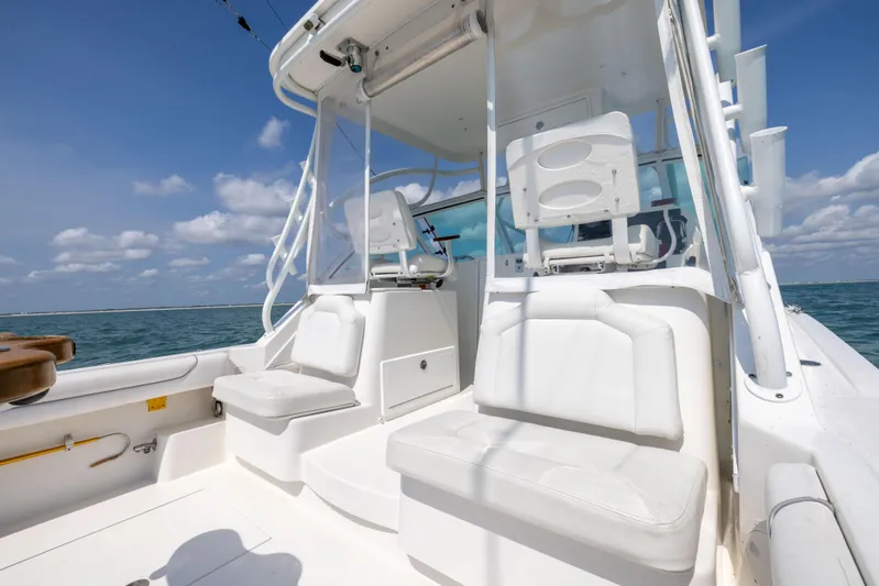  Yacht Photos Pics 2018 Albemarle 27 Express boat interior with white seating and ocean view.