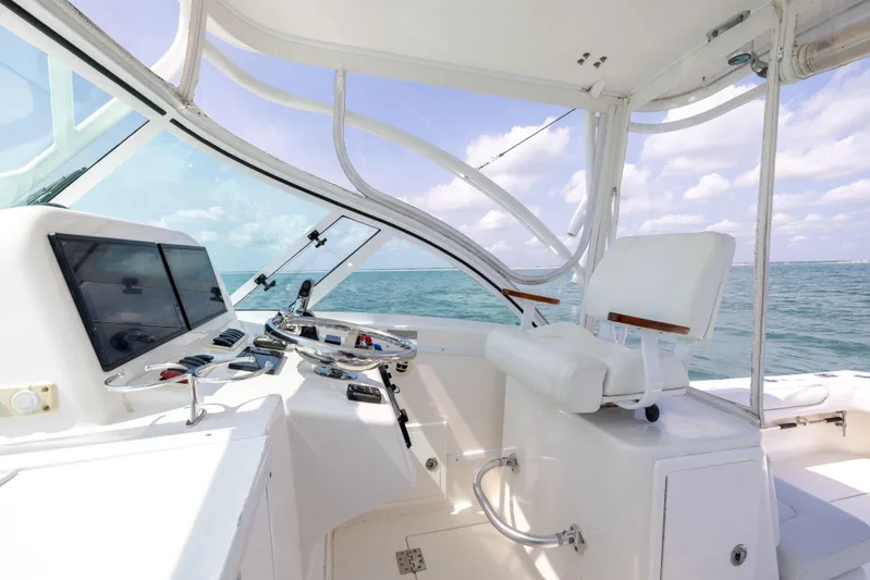  Yacht Photos Pics 2018 Albemarle 27 Express boat helm with ocean view and modern controls.
