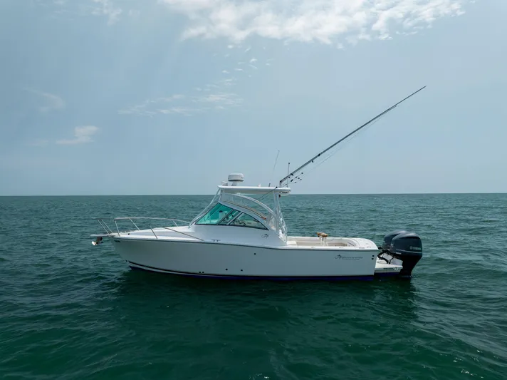  Yacht Photos Pics 2018 Albemarle 27 Express boat on open sea under cloudy sky.