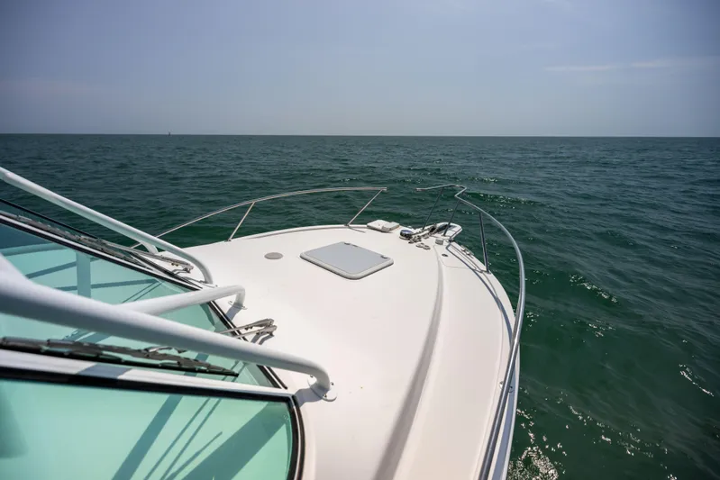  Yacht Photos Pics 2018 Albemarle 27 Express boat cruising on open sea under clear sky.