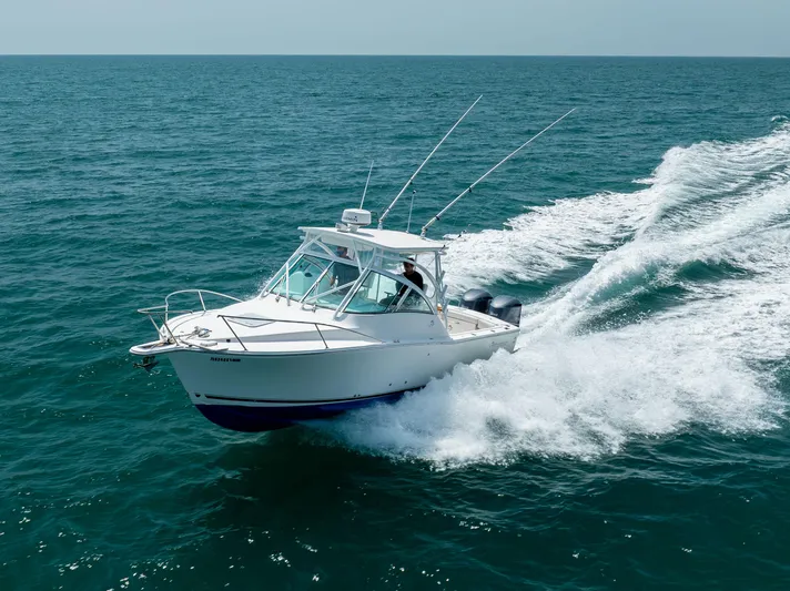  Yacht Photos Pics 2018 Albemarle 27 Express boat cruising on open sea with wake trail.