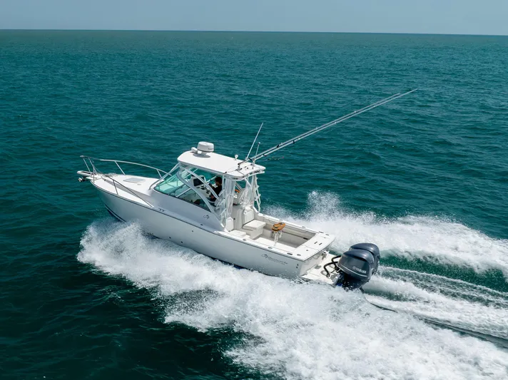  Yacht Photos Pics 2018 Albemarle 27 Express boat cruising on open sea.