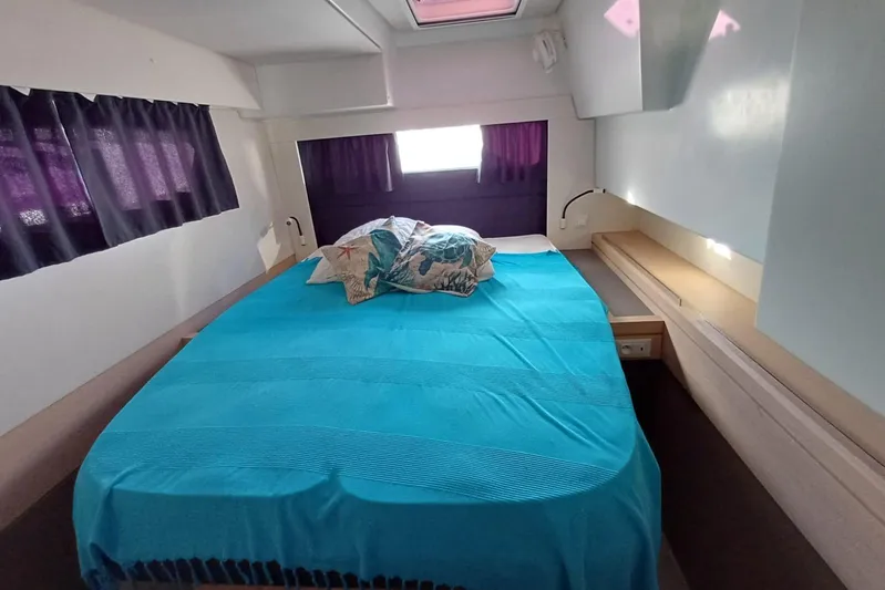  Yacht Photos Pics Cozy bedroom in 2018 Fountaine Pajot Saona 47 yacht with blue bedding.