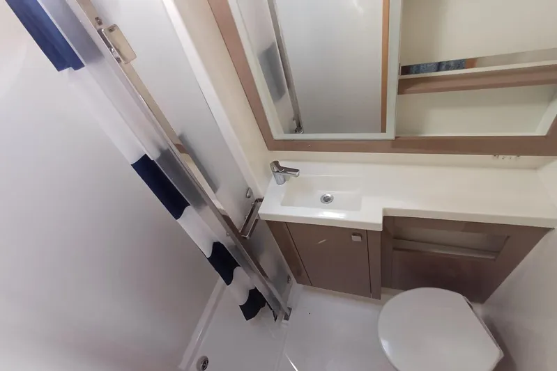  Yacht Photos Pics Bathroom interior of 2018 Fountaine Pajot Saona 47 yacht, featuring modern fixtures and shower.