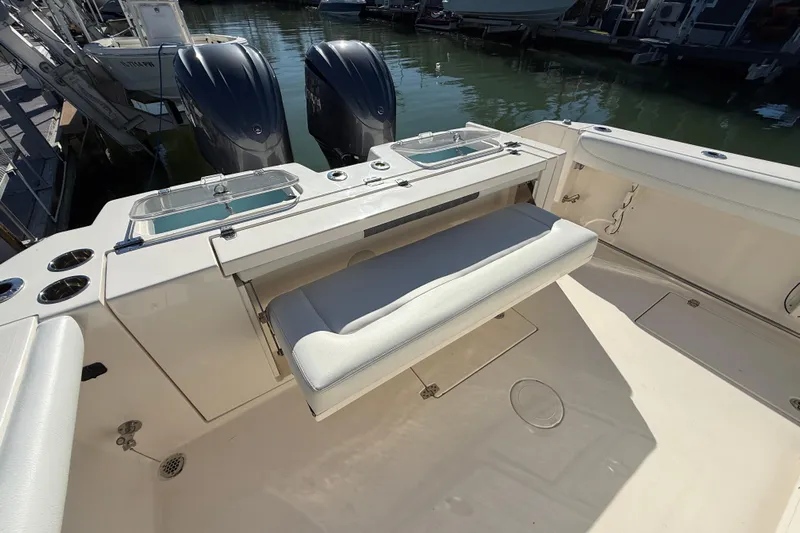  Yacht Photos Pics 2022 Cobia 320 Center Console boat with dual engines and seating area.