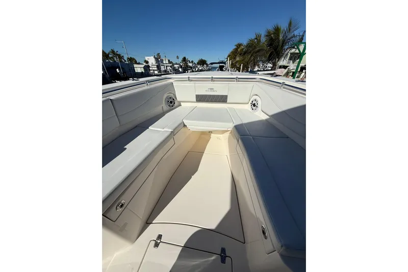  Yacht Photos Pics 2022 Cobia 320 Center Console boat interior with spacious seating and sleek design.