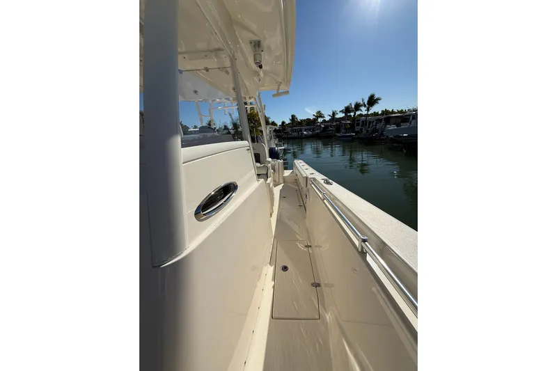  Yacht Photos Pics 2022 Cobia 320 Center Console boat docked in sunny marina.