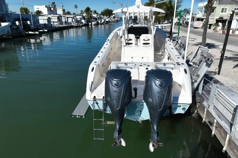  Yacht Photos Pics 2022 Cobia 320 Center Console boat docked with dual outboard engines.