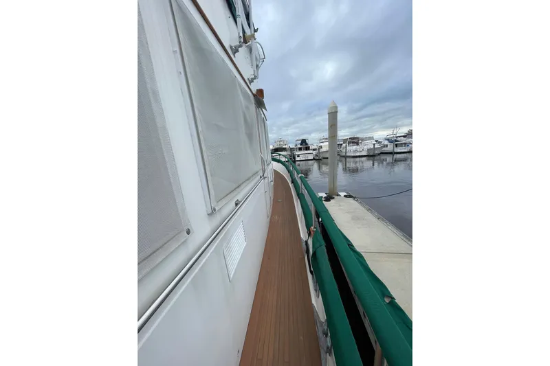 Amazing Grace Yacht Photos Pics 1983 Grand Banks 49 Classic yacht docked at marina, side view.