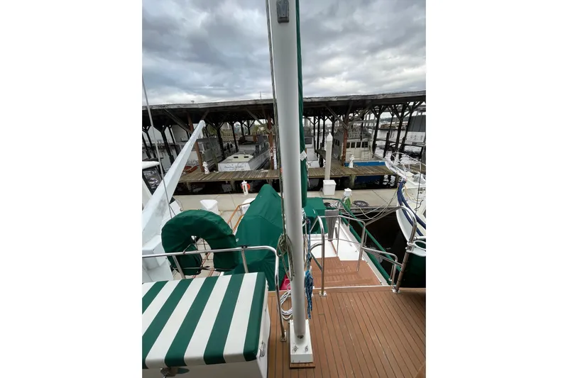 Amazing Grace Yacht Photos Pics 1983 Grand Banks 49 Classic yacht docked at marina under cloudy skies.