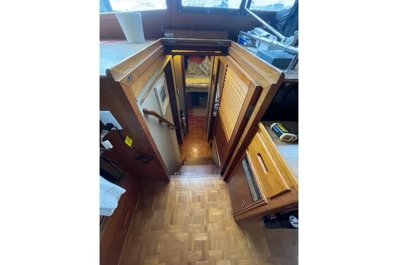 Amazing Grace Yacht Photos Pics Interior view of 1983 Grand Banks 49 Classic yacht with wooden stairs and cabinetry.