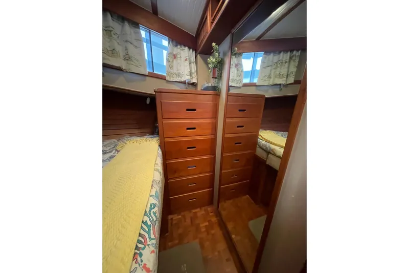 Amazing Grace Yacht Photos Pics Interior of 1983 Grand Banks 49 Classic with wooden drawers and mirrored closet.