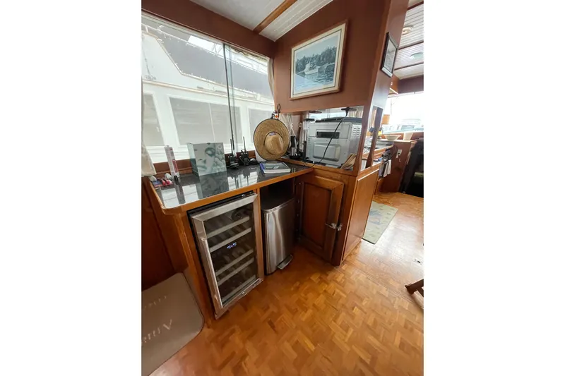 Amazing Grace Yacht Photos Pics Interior of 1983 Grand Banks 49 Classic yacht with wooden cabinetry and modern appliances.