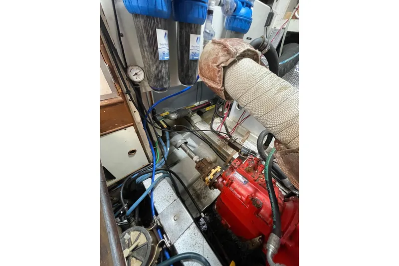 Amazing Grace Yacht Photos Pics Engine room of 1983 Grand Banks 49 Classic with filters and red machinery components.