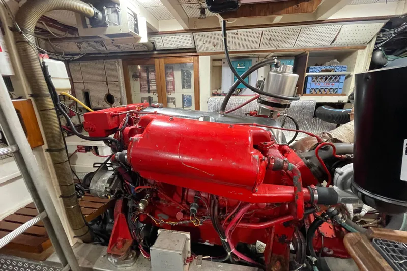 Amazing Grace Yacht Photos Pics Engine room of 1983 Grand Banks 49 Classic with red machinery and equipment.