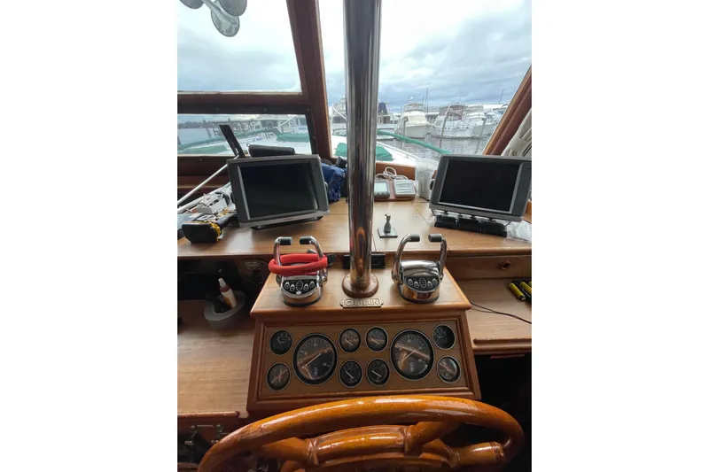 Amazing Grace Yacht Photos Pics Helm of 1983 Grand Banks 49 Classic yacht with navigation instruments and dual monitors.