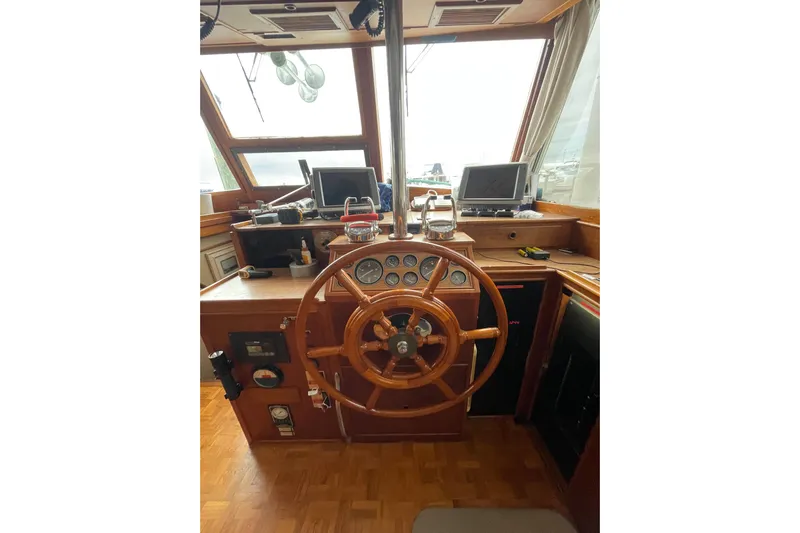 Amazing Grace Yacht Photos Pics 1983 Grand Banks 49 Classic helm with wooden wheel and navigation instruments.