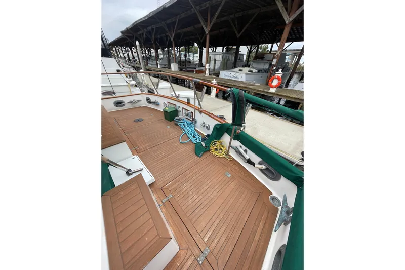 Amazing Grace Yacht Photos Pics 1983 Grand Banks 49 Classic yacht deck with wooden flooring and dockside view.