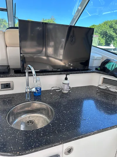 Zincohvid Yacht Photos Pics Luxury yacht interior with sink, countertop, and TV on a 2008 Four Winns V458.