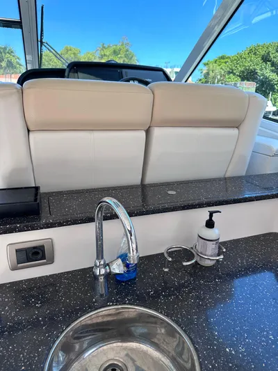 Zincohvid Yacht Photos Pics 2008 Four Winns V458 yacht interior with sink and countertop, featuring a sleek design.