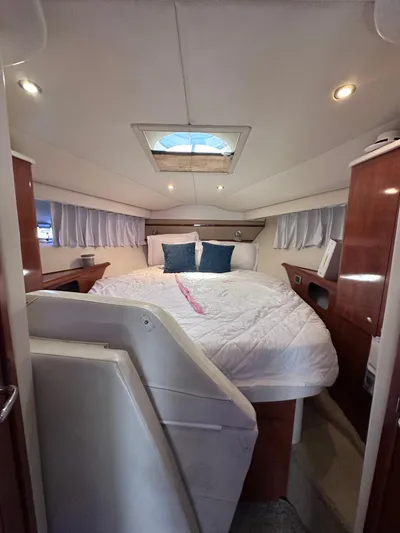 Zincohvid Yacht Photos Pics Luxurious cabin interior of 2008 Four Winns V458 yacht with cozy bedding and elegant wood finishes.