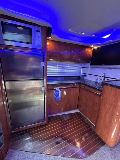 Zincohvid Yacht Photos Pics Luxurious 2008 Four Winns V458 yacht kitchen with modern appliances and ambient lighting.